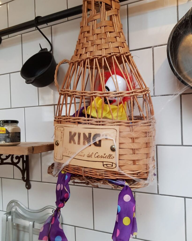halloween decoration of clown in a cage