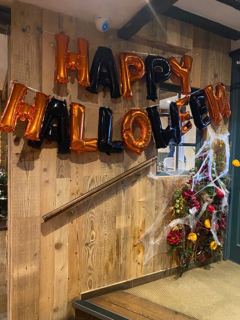 happy Halloween balloons in a country pub