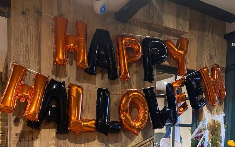 happy halloween balloons set in the main entrance of a country pub