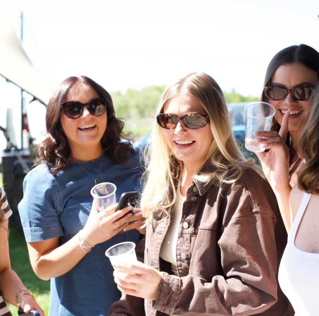 Rose festival at wildshark vineyard girls enjoying their english wine