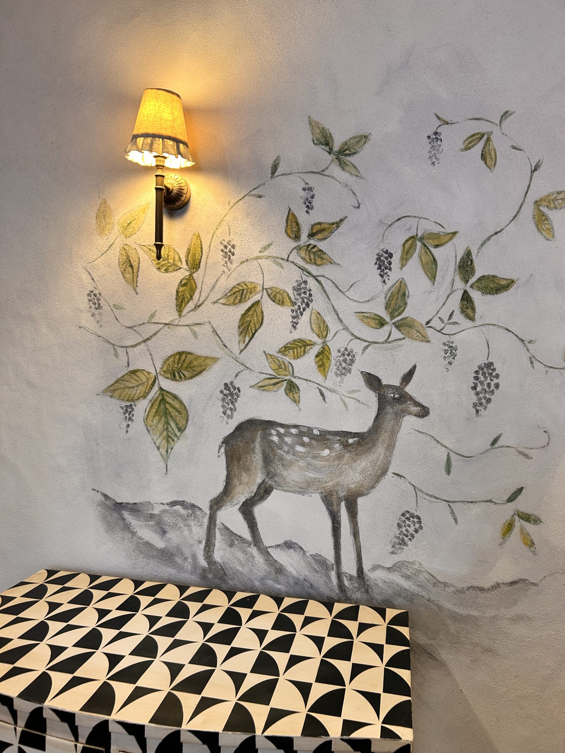 mural on wall of country bedroom